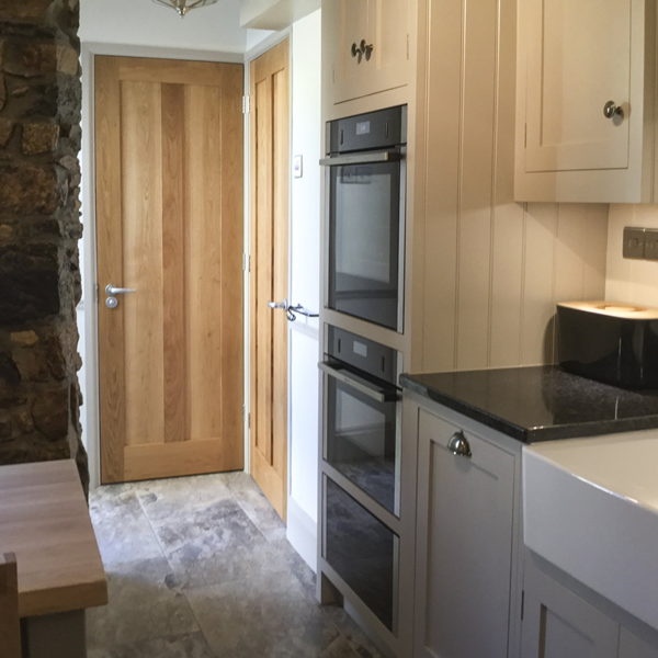 3 panel oak doors in a modern kitchen design
